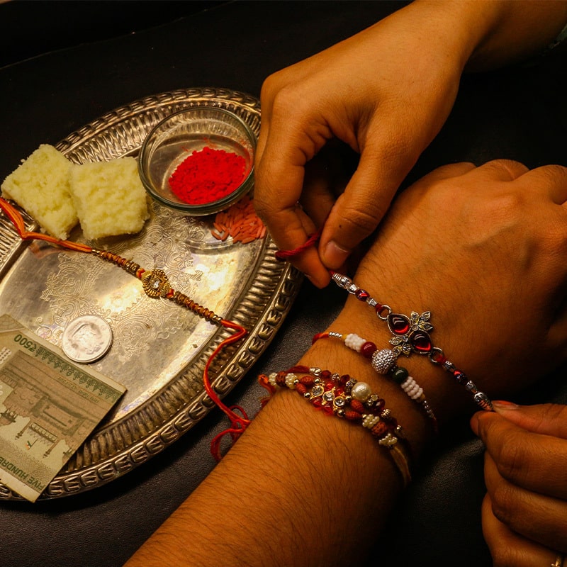 Love & Happiness All in One: Unique Silver & Gold Rakhi Gifts by GIVA