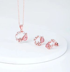 दिवाली पोशाक के लिए बिल्कुल सही गुलाबी सोने के आभूषणों की जोड़ी