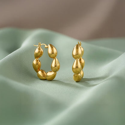 Golden Graceful Twist Hoop Earrings