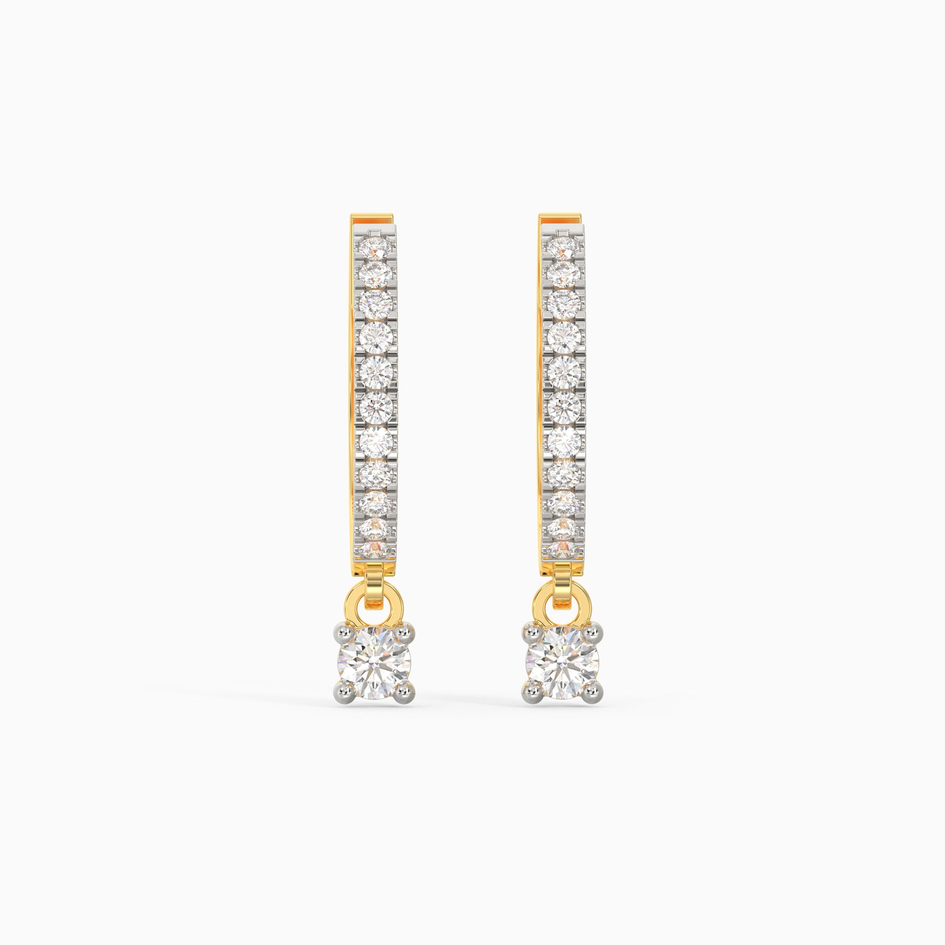 A pair of gold hoop diamond earrings with a dangling drop design