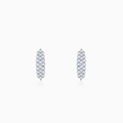Gold oval earrings with double row of lab-grown diamonds, set in a paved setting for continuous sparkle.