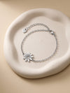 IXIA by GIVA Monsoon Floral Rhodium Plated Rakhi Bracelet