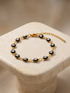 IXIA by GIVA Black Evil Eye Gold Plated Rakhi Bracelet