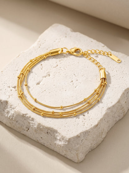 IXIA by GIVA Twist Script Gold Plated Bracelet