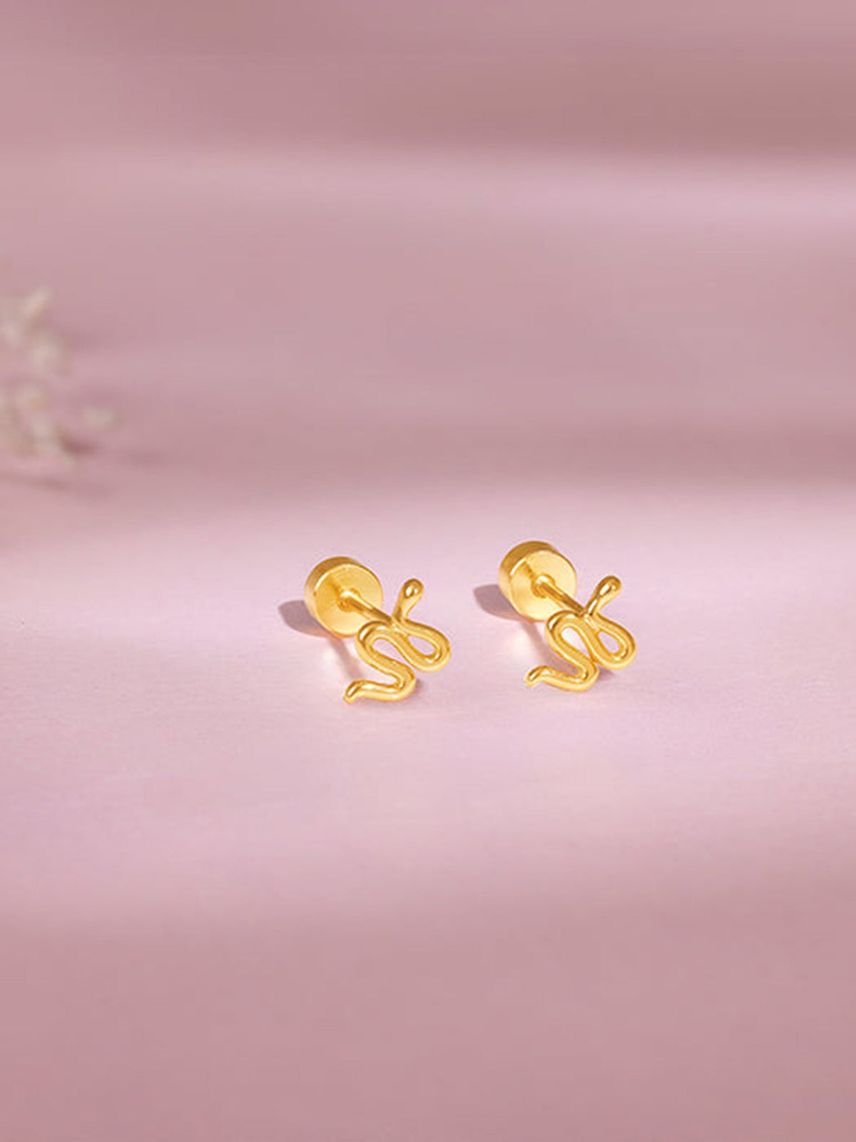 Golden Medusa Ear Piercings