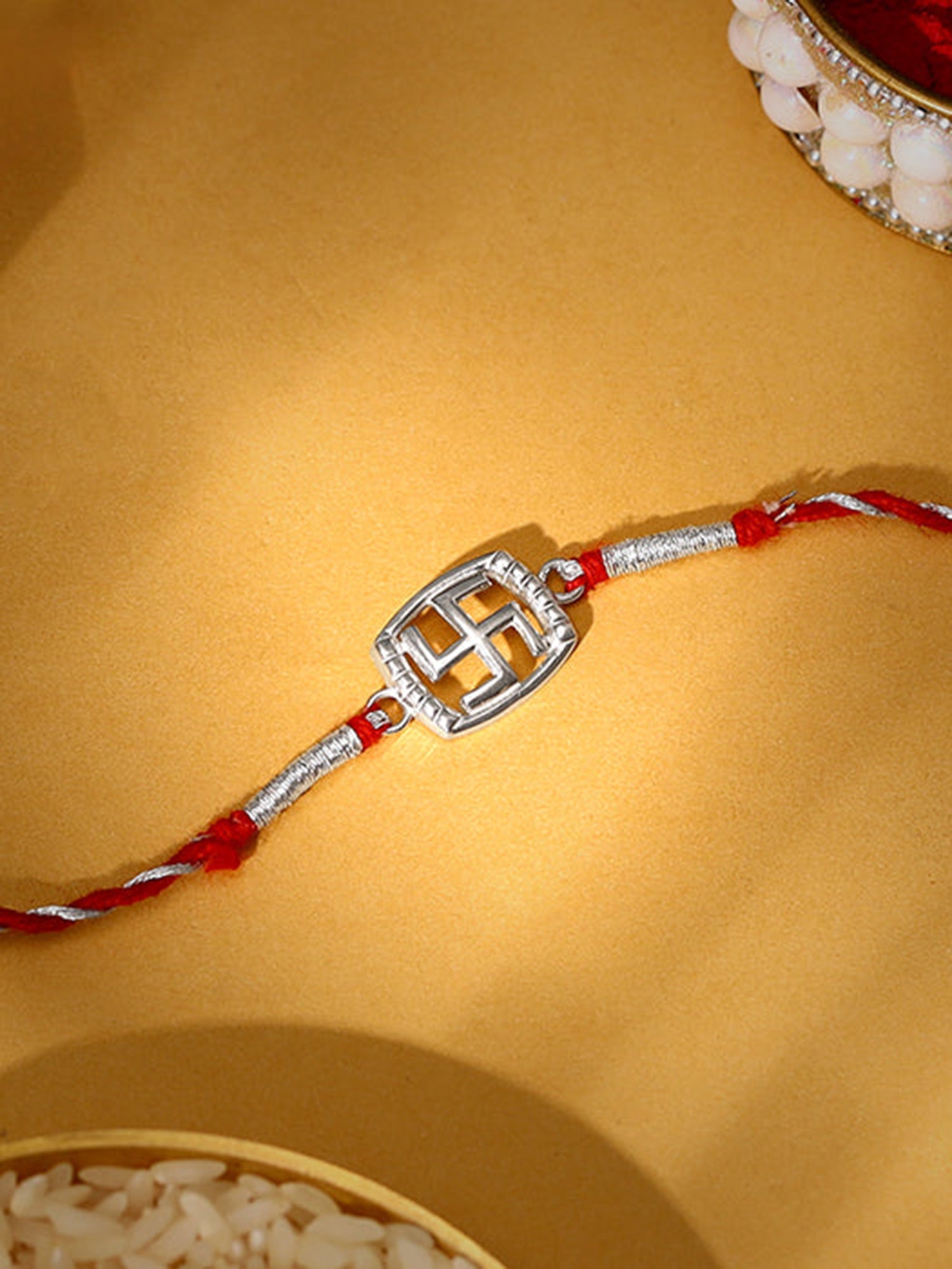 Silver Swastik In Square Rakhi