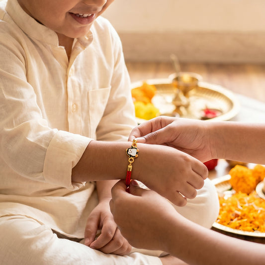 Golden Penguin Joy Rakhi