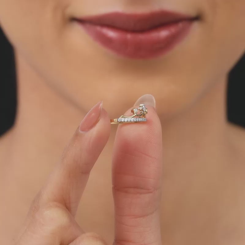 Gold crown-shaped diamond ring with delicate diamonds